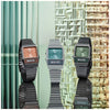 Three vintage-style watches on a reflective surface with a textured wall background