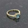 9ct Yellow Gold Emerald Cut Blue Topaz and Diamond Dress Ring | H&H